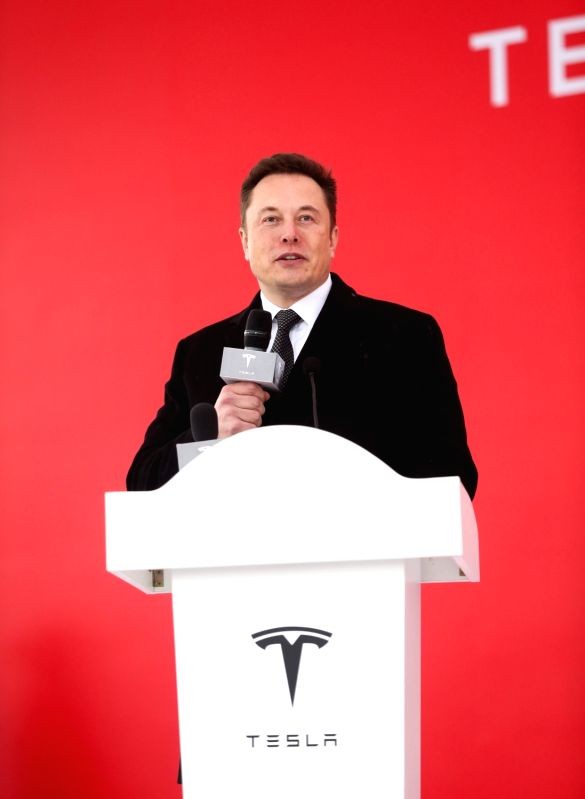 Elon Musk speaking at a Tesla event